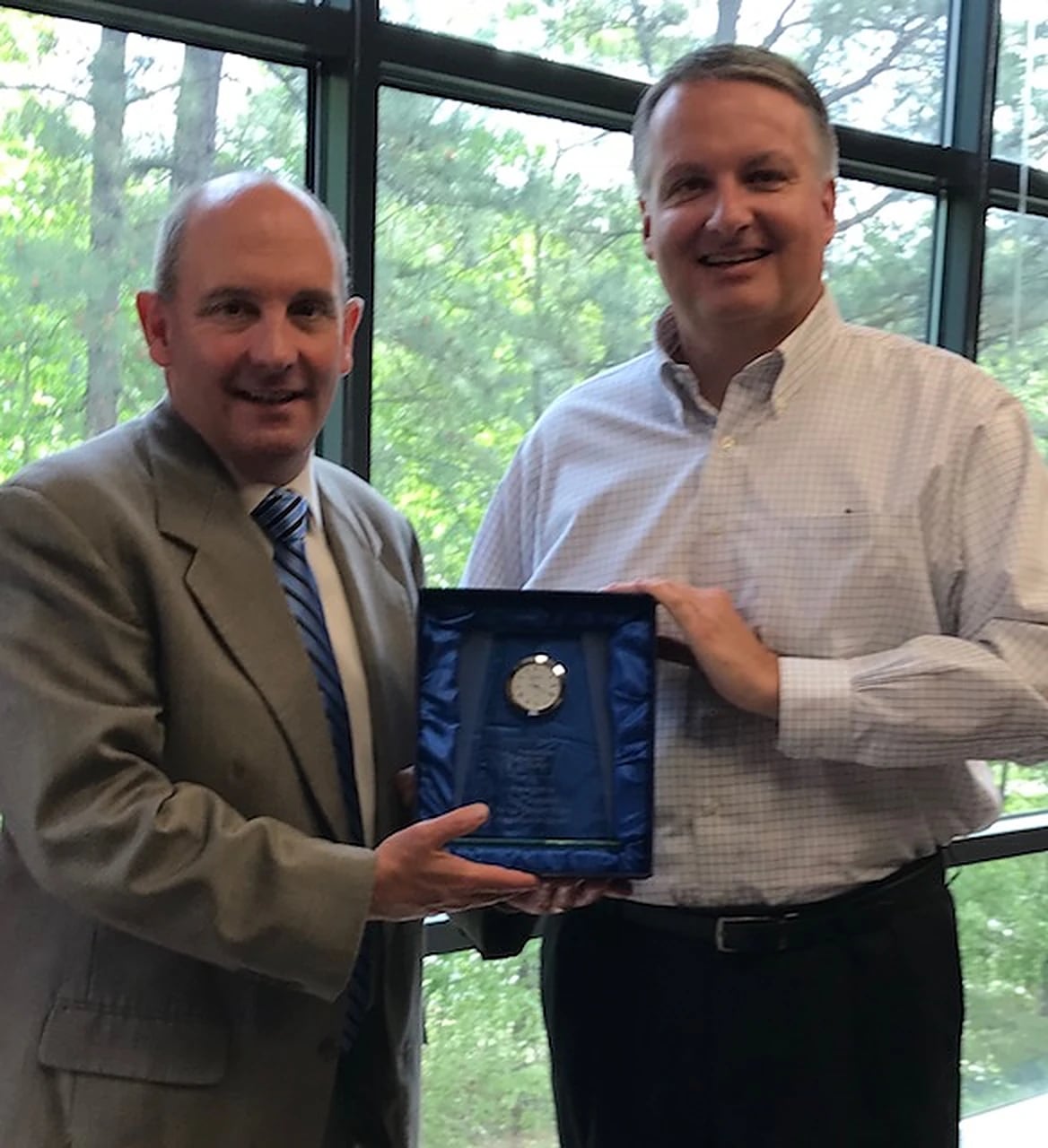 Thomas P. Marshall receiving a community recognition award