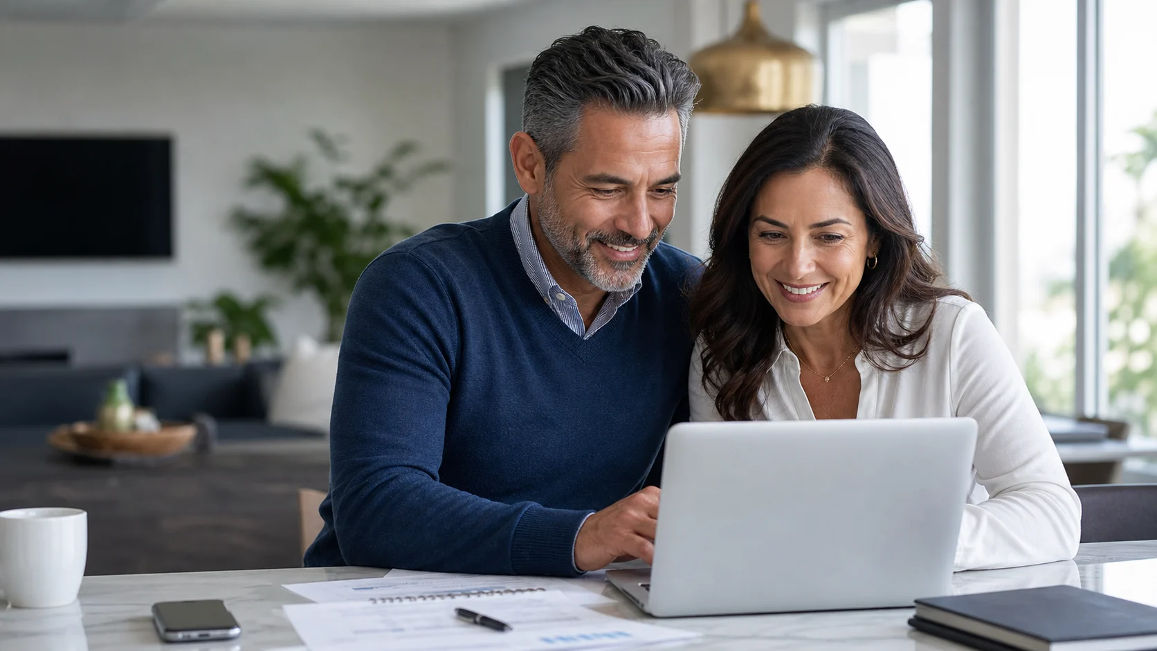 Couple in their fifties reviewing their financial plan together